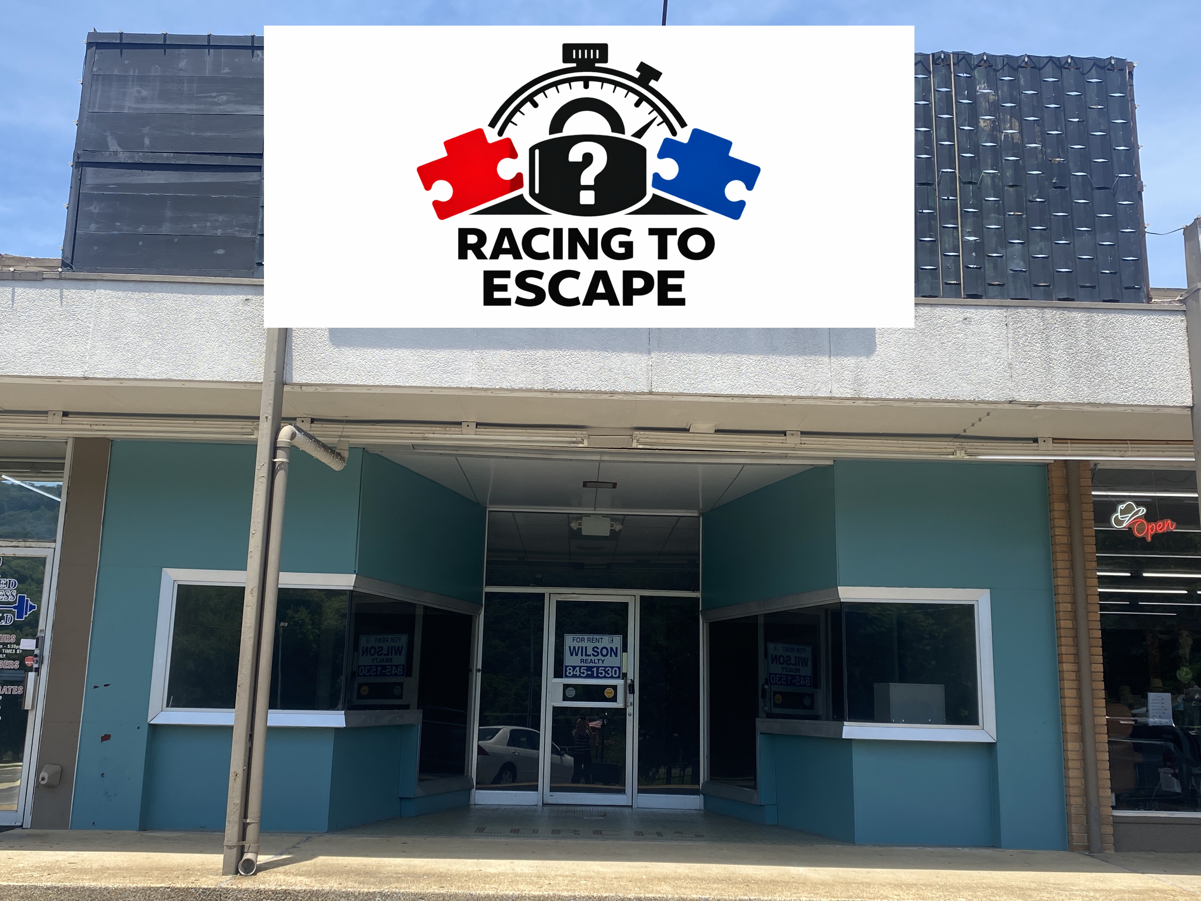 Coming soon storefront for Racing to Escape in downtown Fort Payne